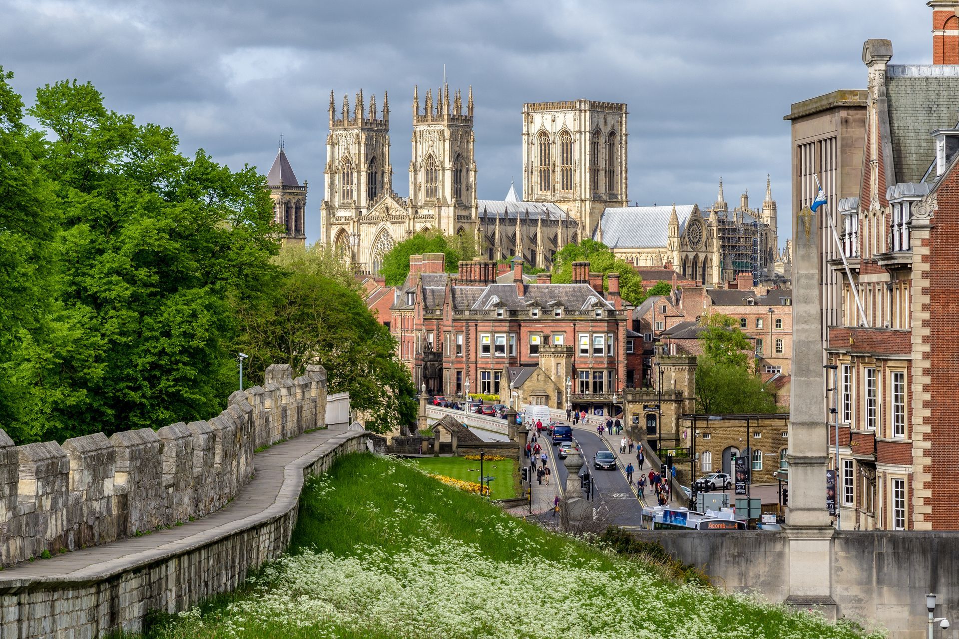 York Minster cathedral and city buildings viewed from stone city walls.