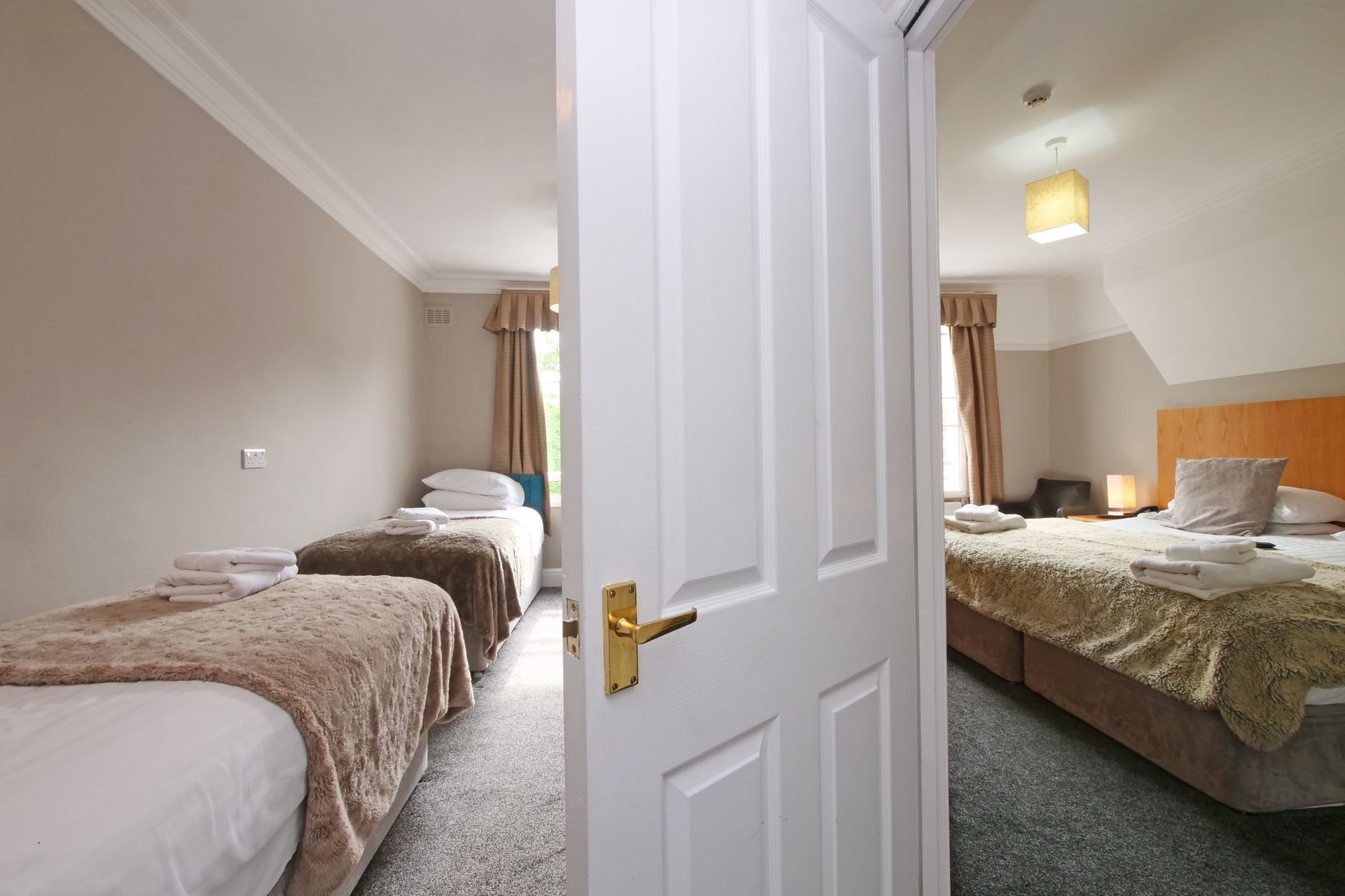 A double bed in one room and 2 singles adjoining room.  Sharing a shower en-suite. 