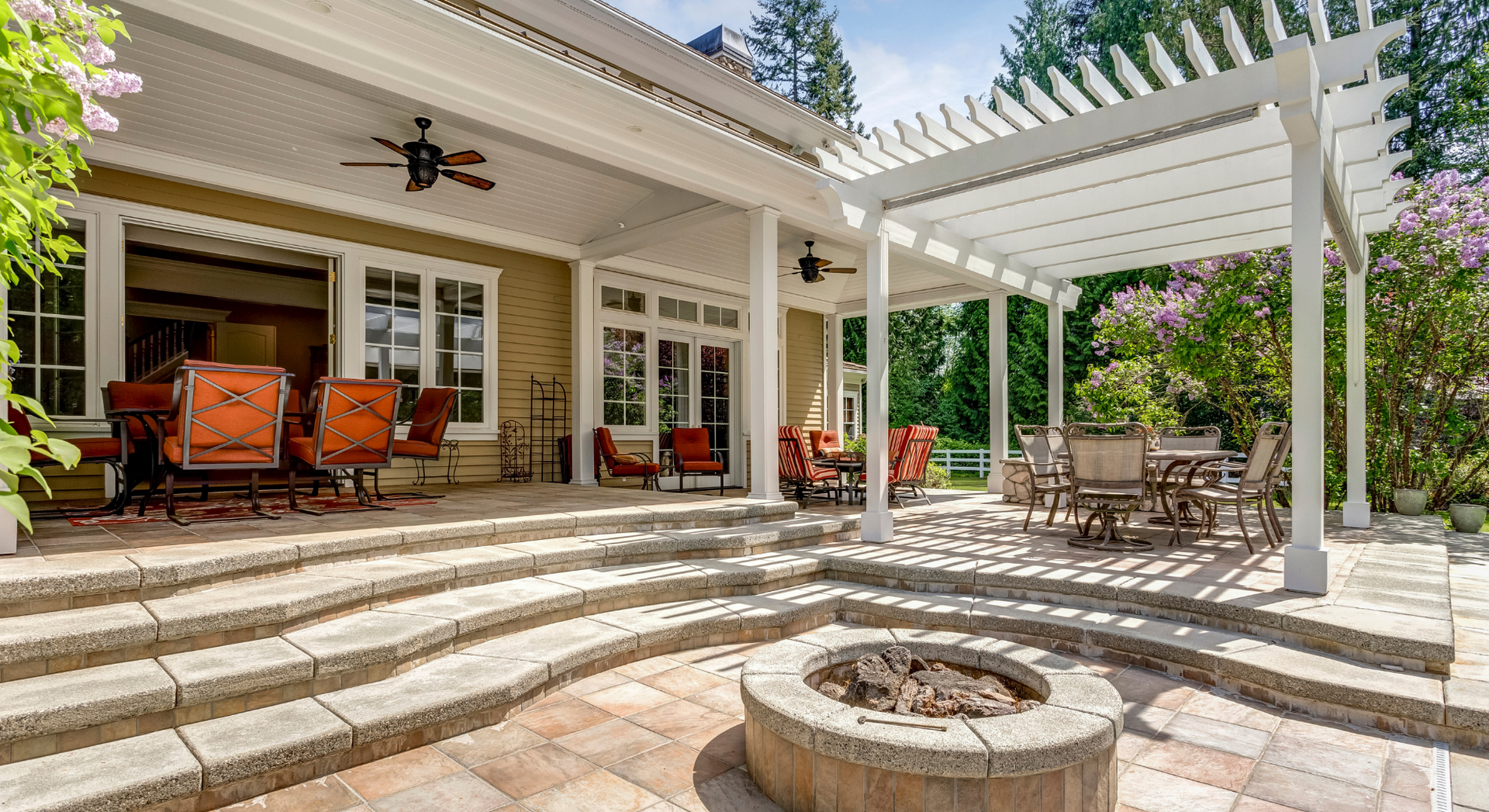 There is a fire pit in the middle of the patio.