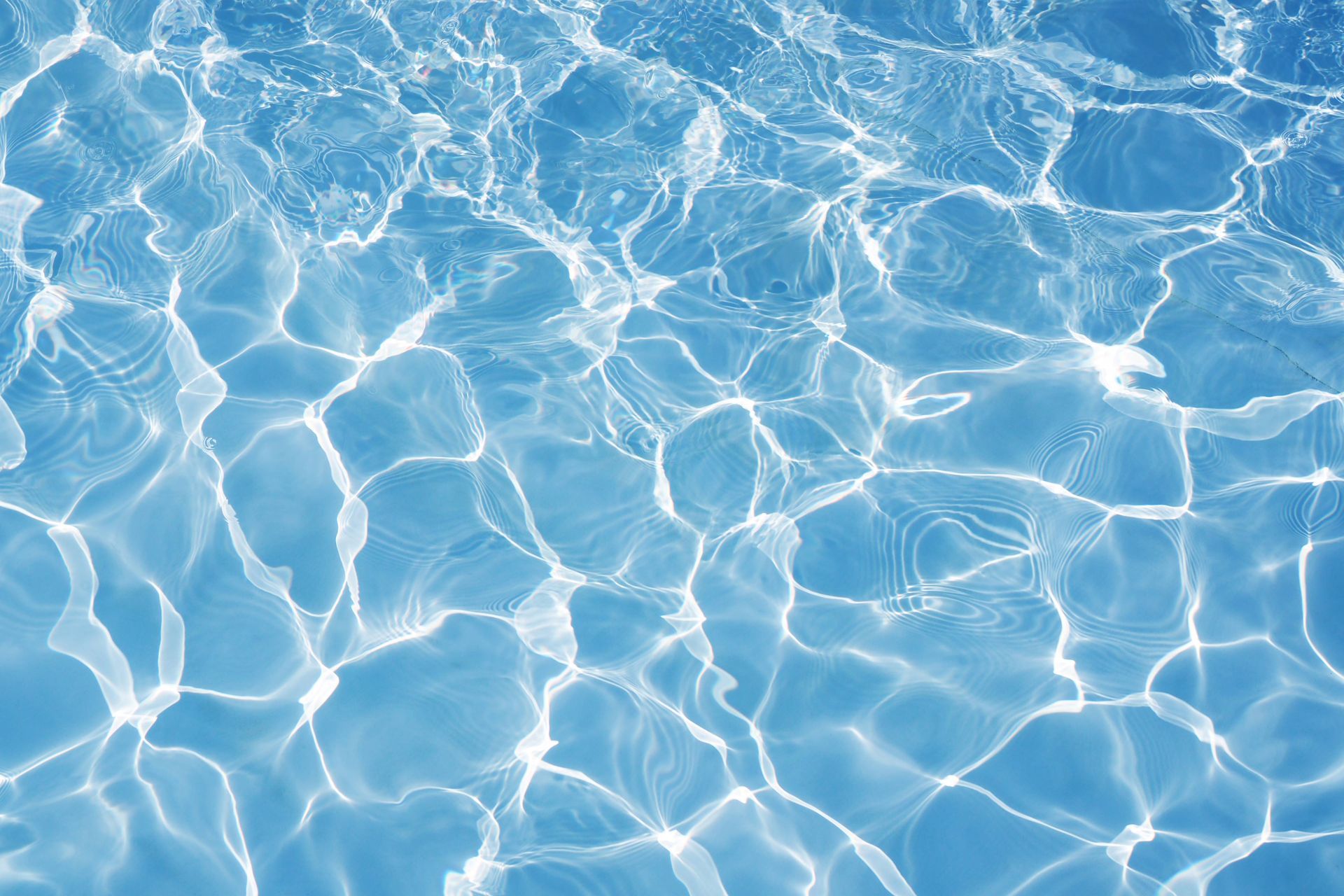 A close up of the water in a swimming pool