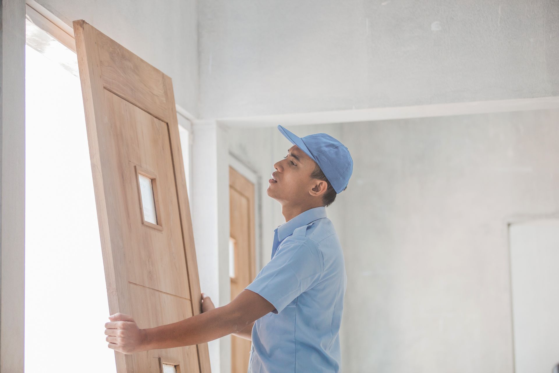 Worker installing doors