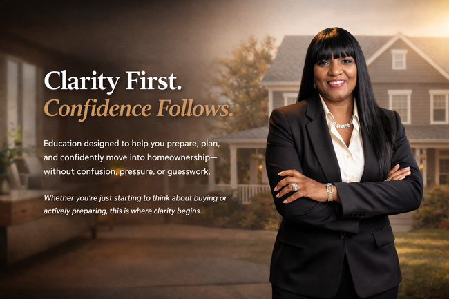 Woman in a suit smiling at two people at a table, likely in a business meeting. City view in background.