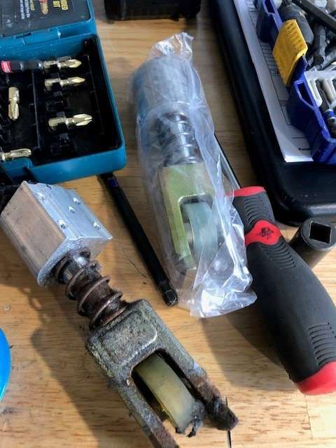 A bunch of tools are sitting on a wooden table