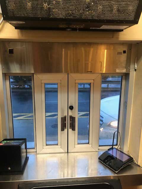 A stainless steel counter top in front of a window