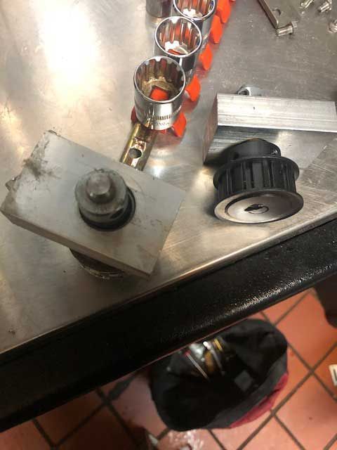 A stainless steel table with a bunch of tools on it