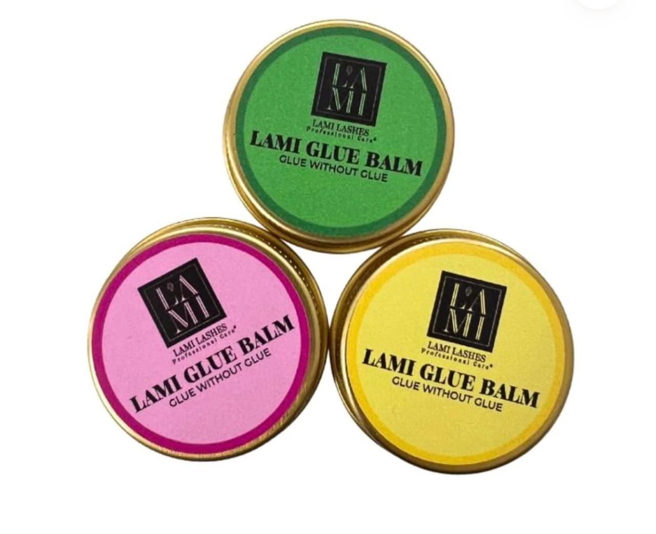 three cans of lami glue balm are stacked on top of each other