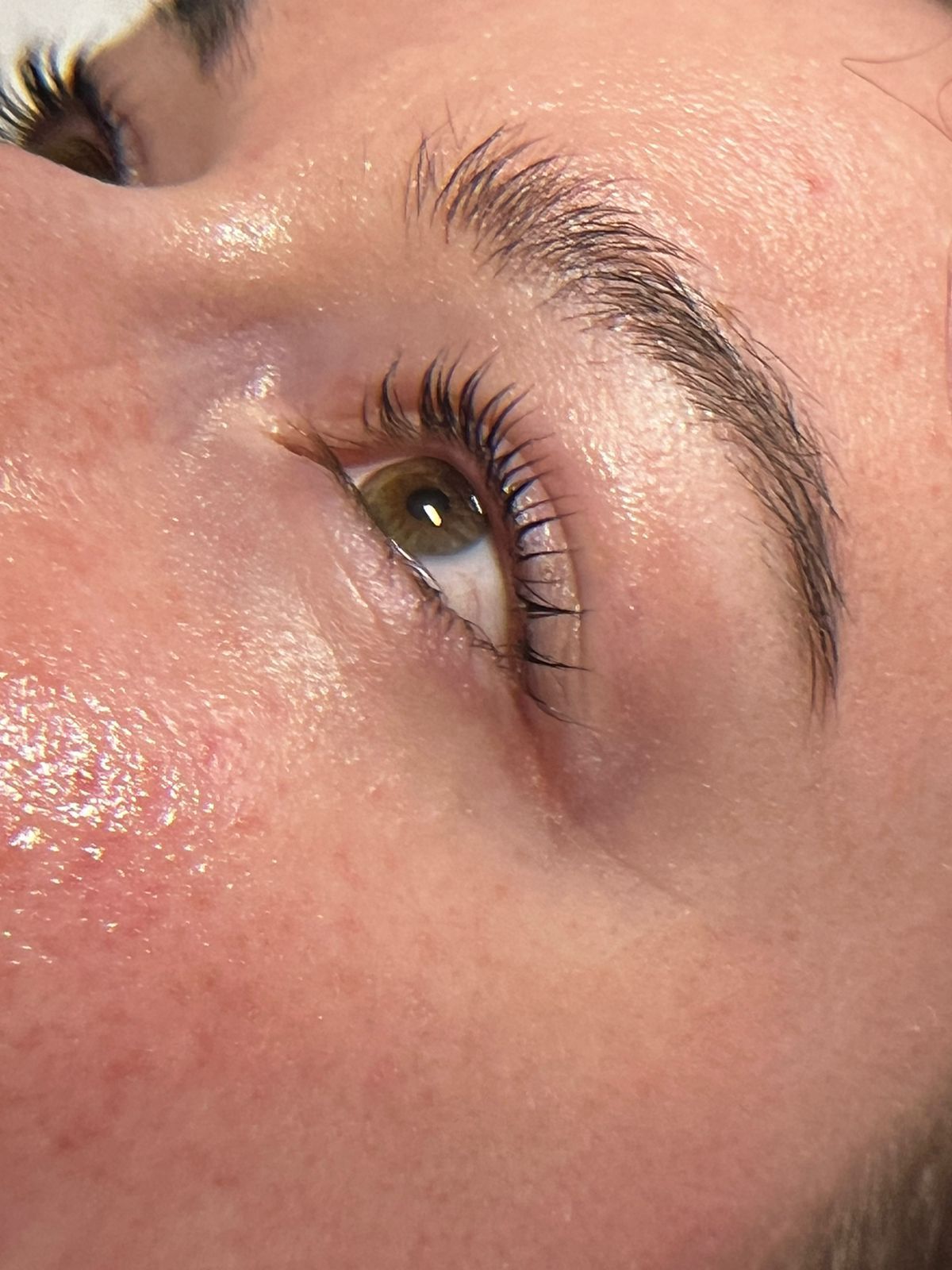 a close up of a woman getting eyelash extensions