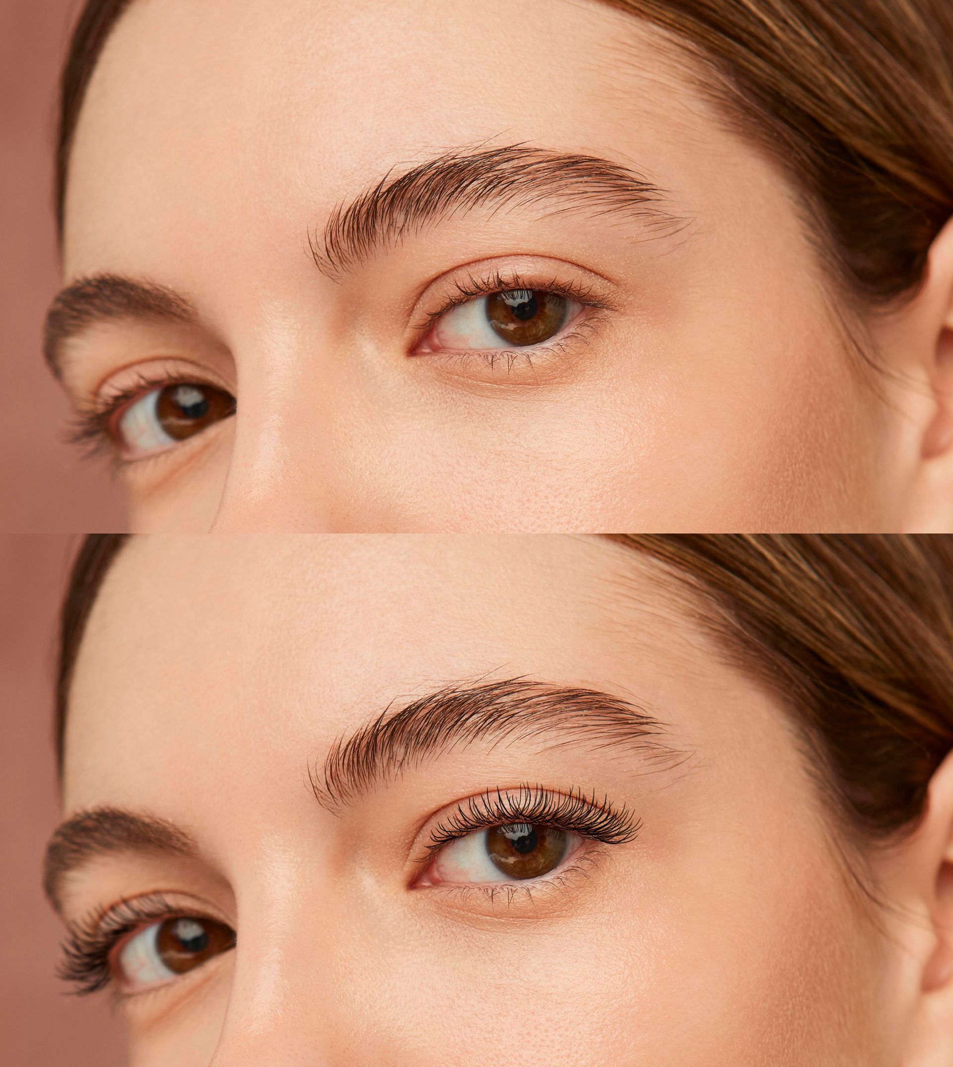 a woman is touching her eyebrow with her finger .