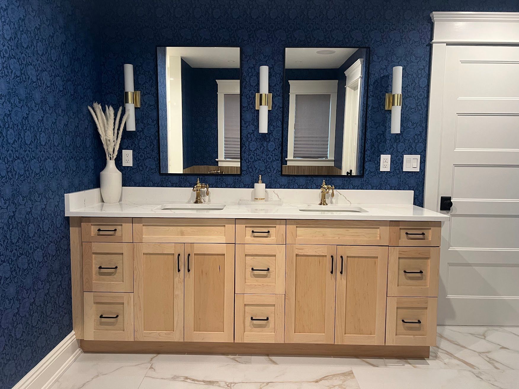 A bathroom with two sinks and two mirrors.