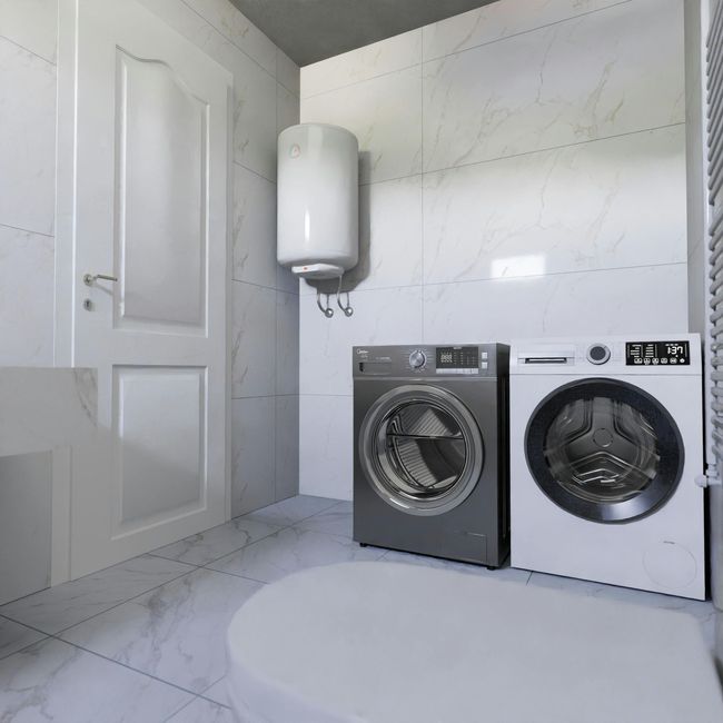 A bathroom with a washer and dryer and a water heater