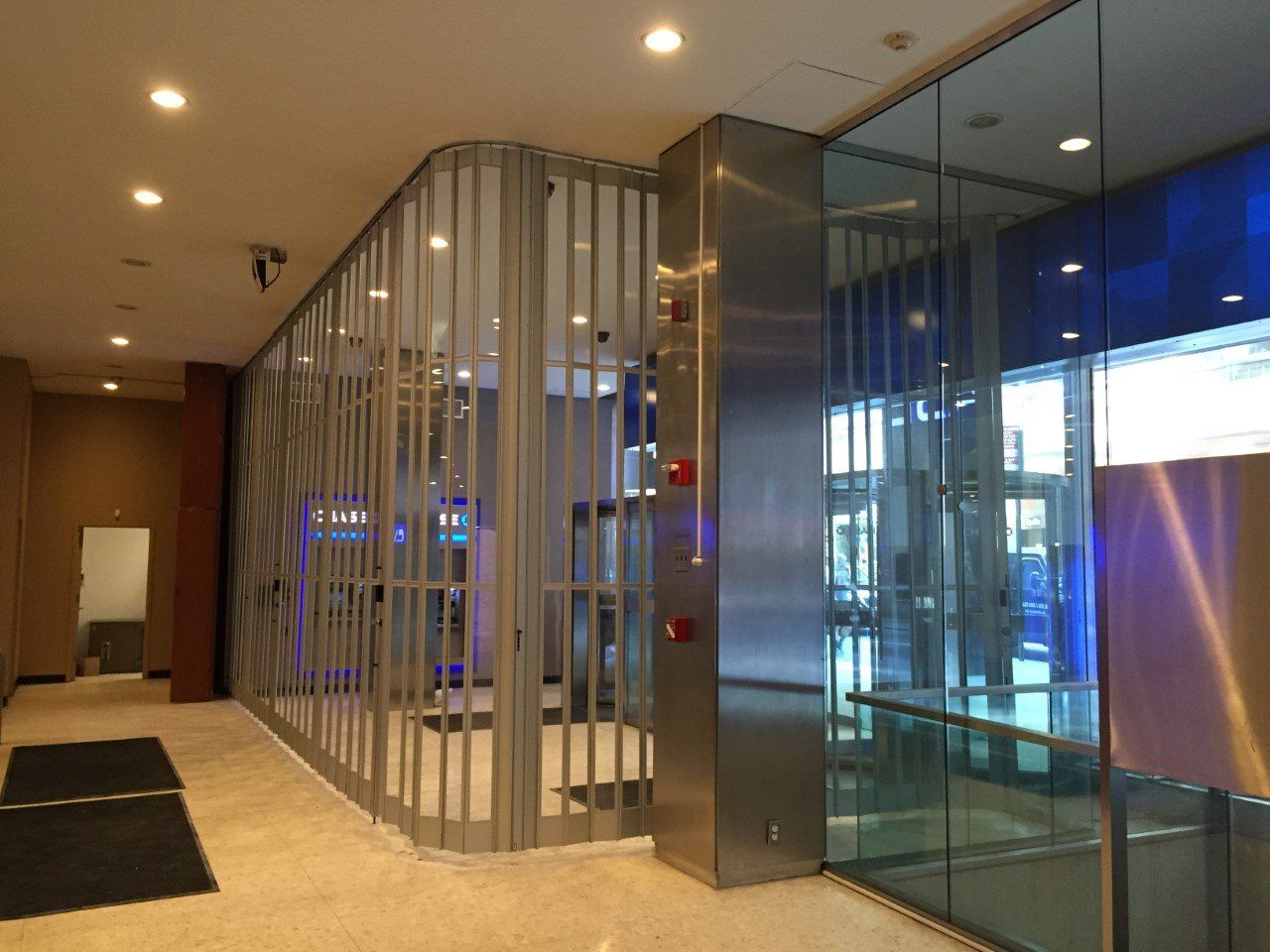 Sliding Gate In Bank Lobby with Glass - Brooklyn, NY - Thompson Overhead Door