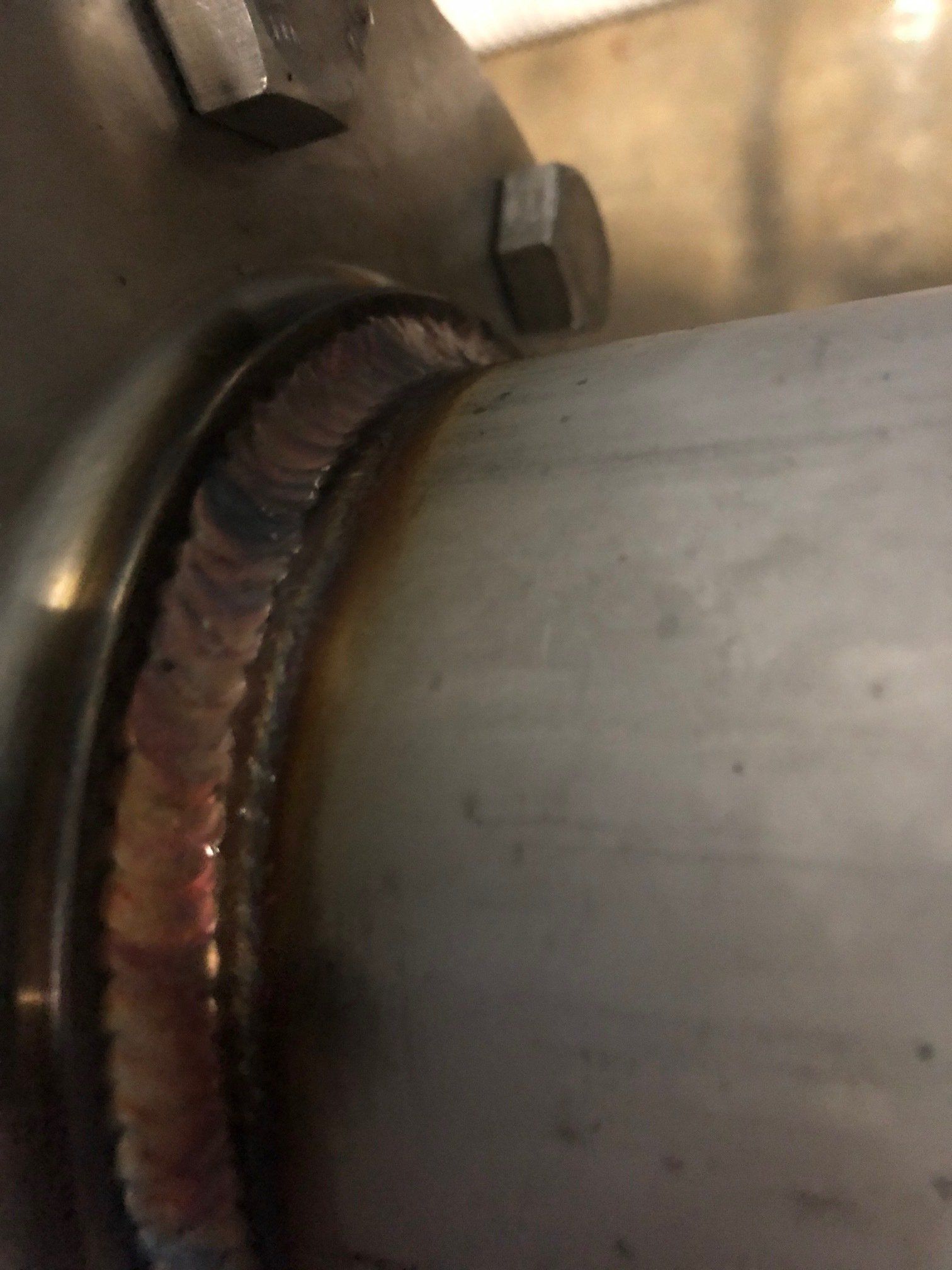 a close up of a welding joint on a metal pipe