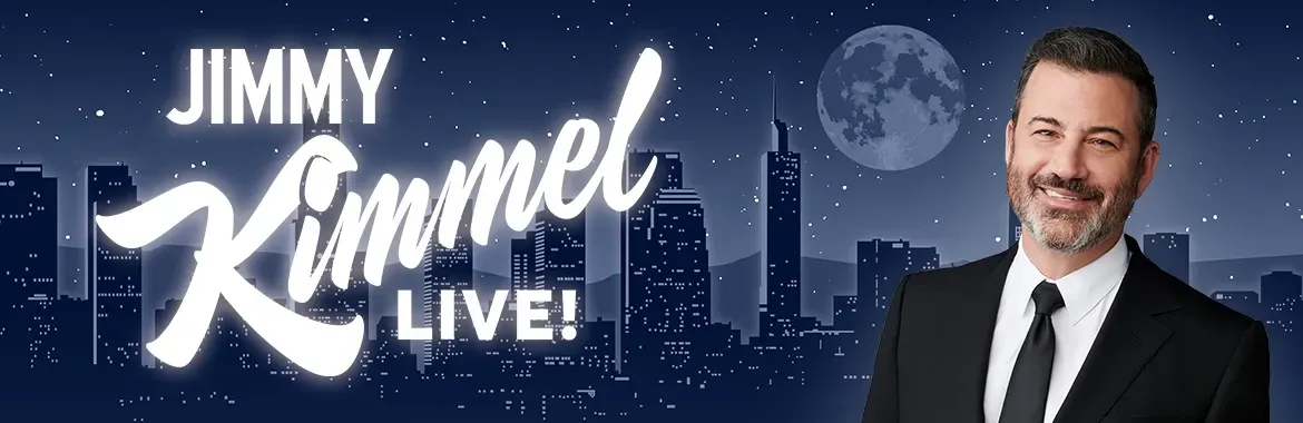 A man in a suit and tie is standing in front of a jimmy kimmel live logo.