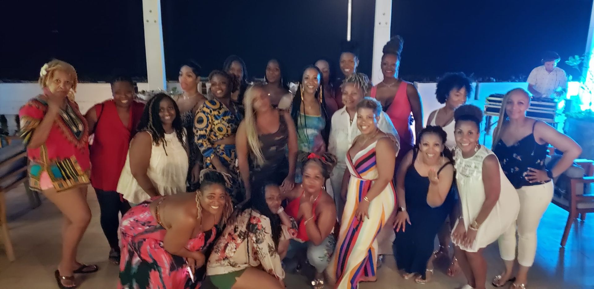 A group of women are posing for a picture together.
