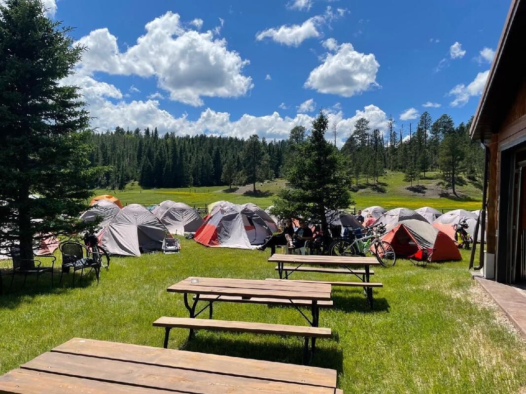 A sunset over a mountain range with a lot of fog