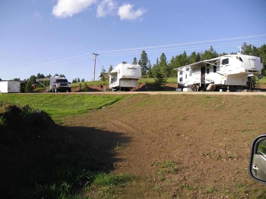 A sunset over a mountain range with a lot of fog