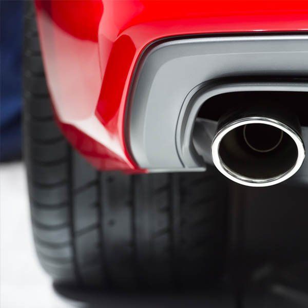 tail of exhaust pipe on red suv