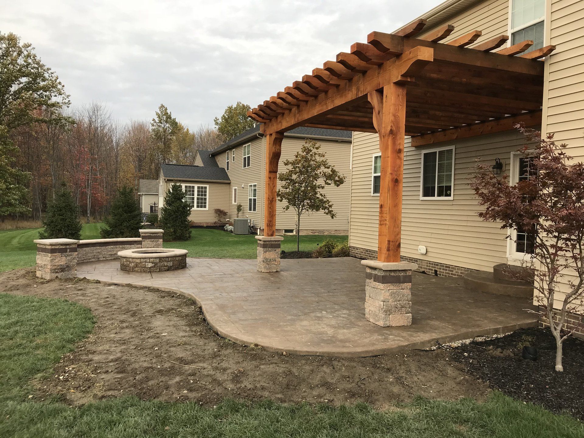 Backyard Wood Pillars and Fire Pit | Strongsville, OH | Bella Cement