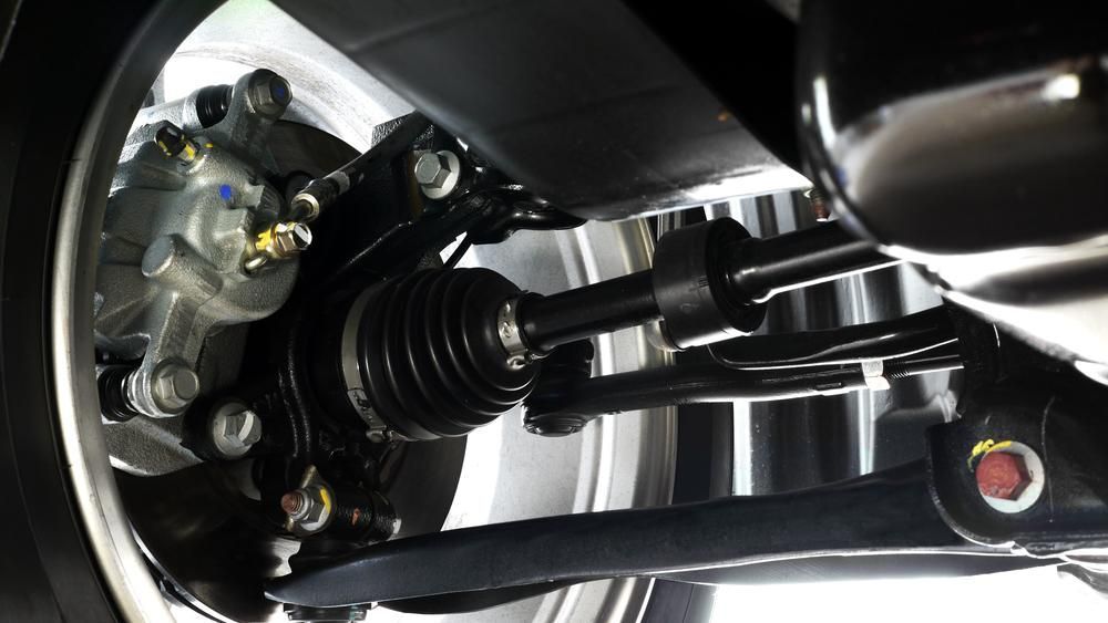 A Close Up Of The Underside Of A Car's Suspension System — Reef Diesel Injection In Moranbah, QLD