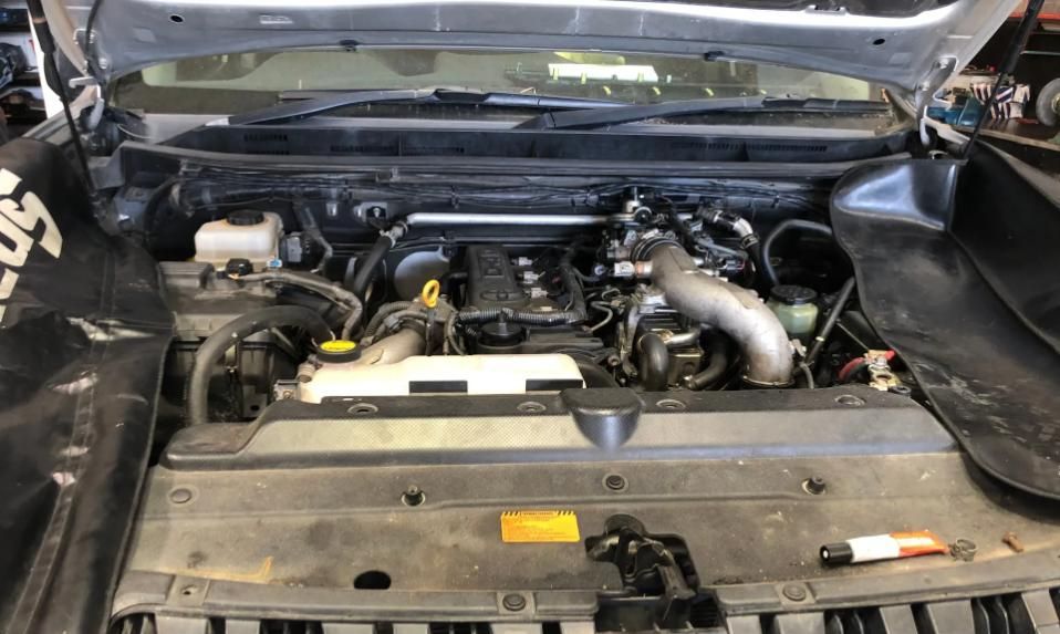 The Engine Of A Car Is Shown With The Hood Open — Reef Diesel Injection In North Mackay, QLD