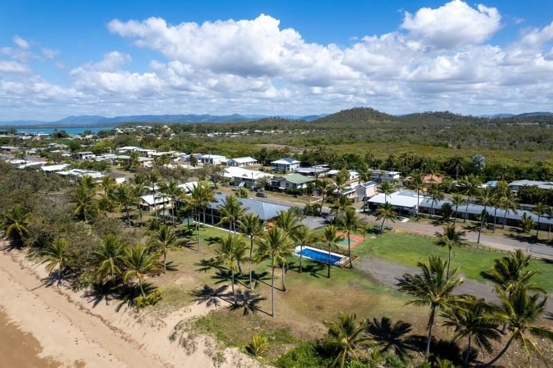 An Aerial View Of A Beach With Palm Trees And Houses — Reef Diesel Injection In Sarina, QLD