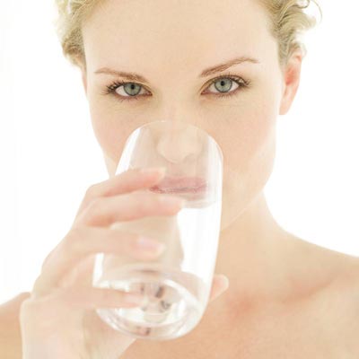 Woman Drinking Water — Well Cleaning and Rehabilitation in Kokomo, IN