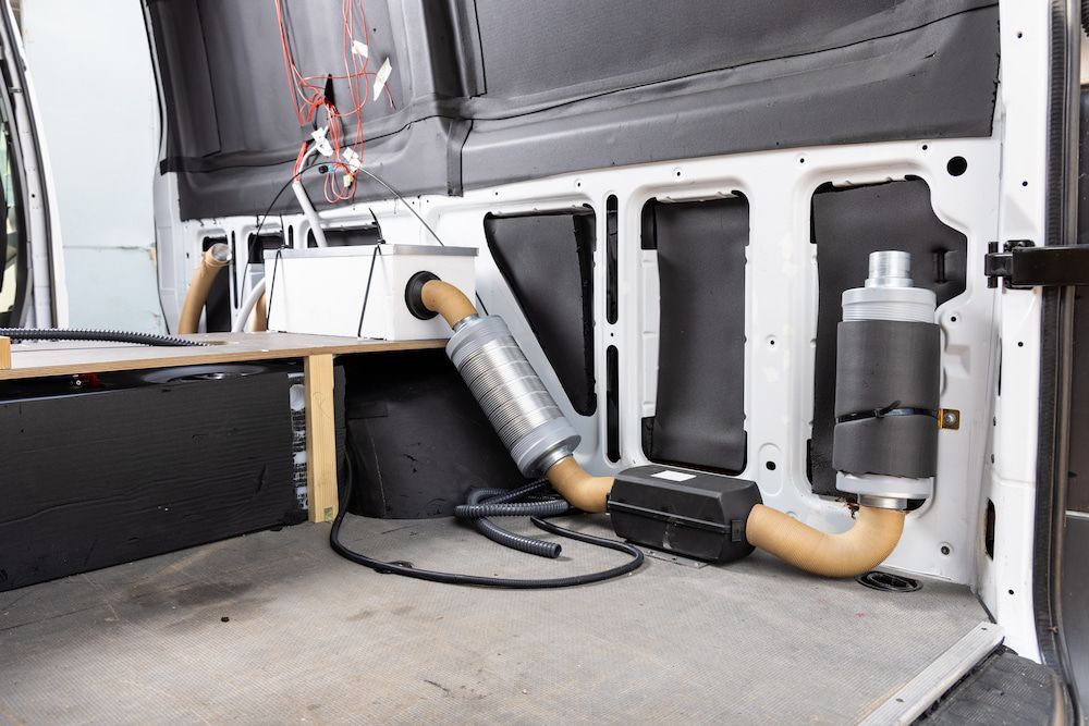 Interior of a White Van With a Diesel Heater Installation — Total Caravan Repairs in Taree, NSW