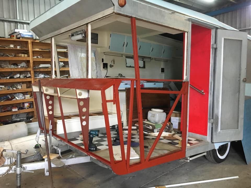 Restored Vintage Caravan, Open Doorway With Red Frame — Total Caravan Repairs in Forster, NSW