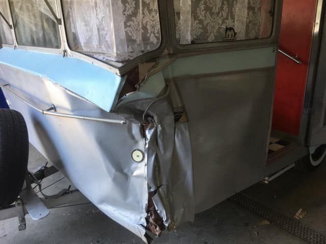 Damaged Vintage Camper Trailer With Crushed Front Panel — Total Caravan Repairs in Taree, NSW