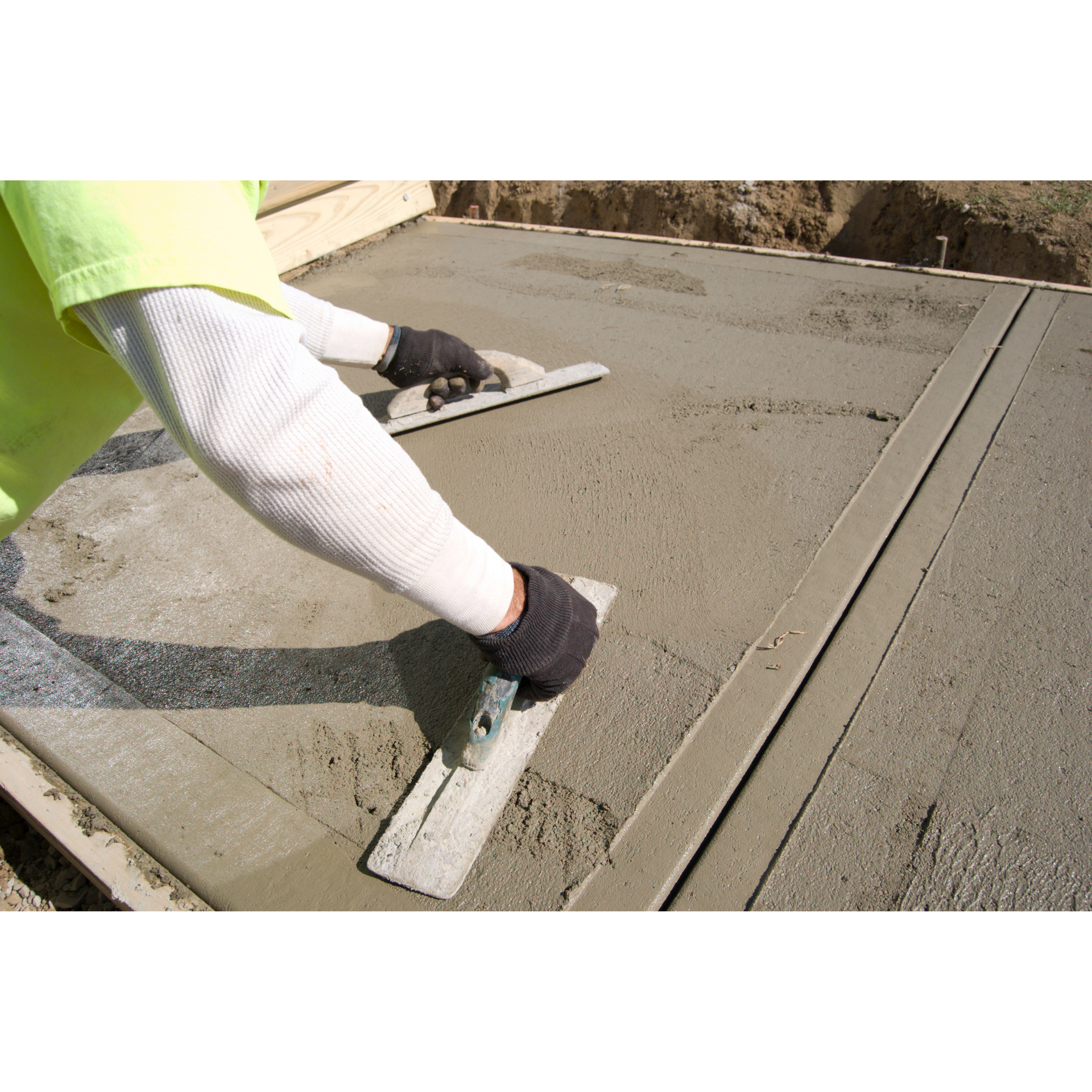 A person is using a trowel to spread concrete on a sidewalk.
