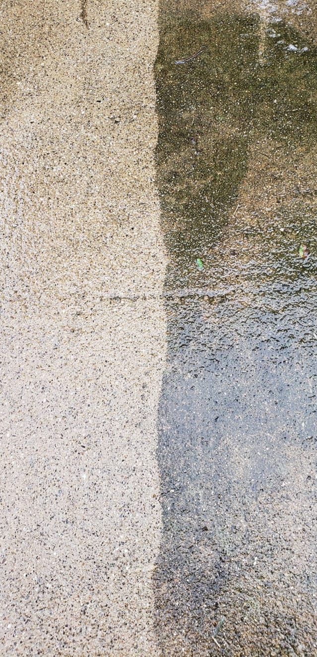 A close up of a concrete surface before and after being cleaned.