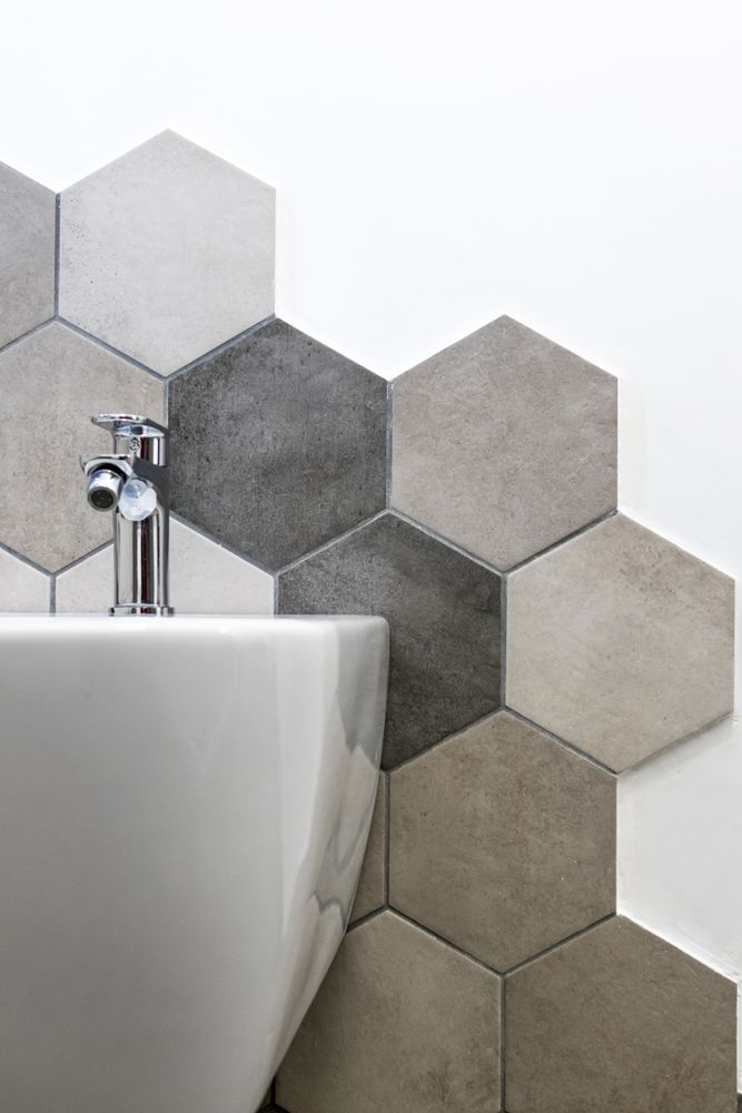 A Bathroom Sink With Hexagonal Tiles on the Wall — Accurate Tiling MNC In Dunbogan, NSW