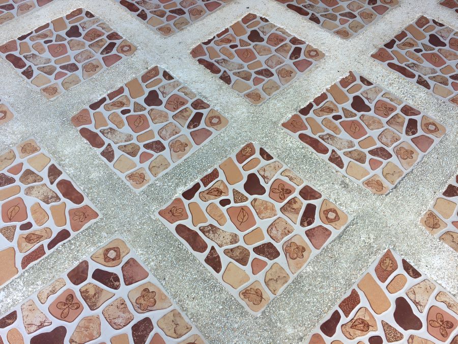 A Row of Square Tiles With a Brown and White Pattern — Accurate Tiling MNC In Dunbogan, NSW