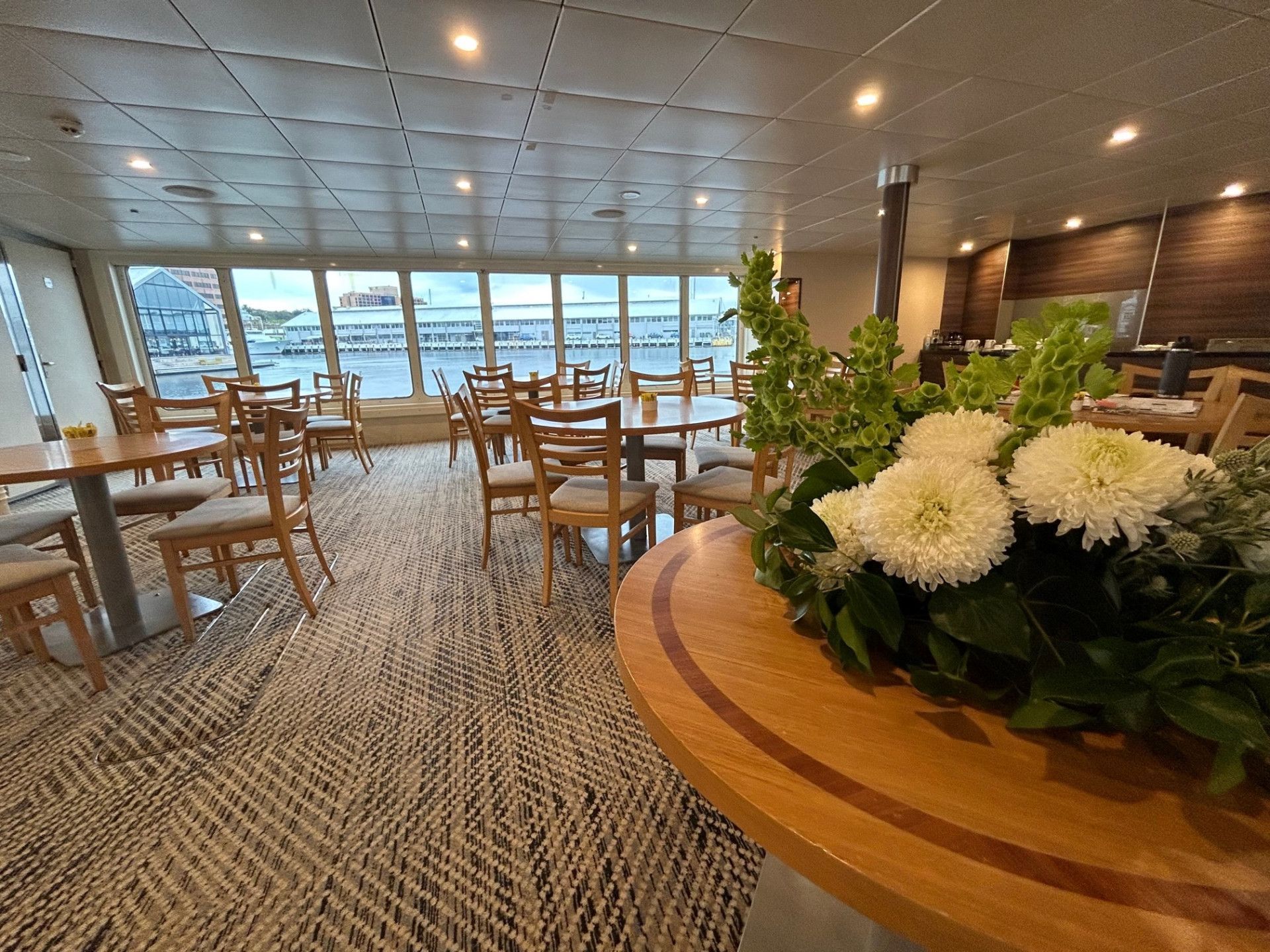 The Inside of a Boat With a Table and Couch — John Chisholm Flooring in Manunda, QLD