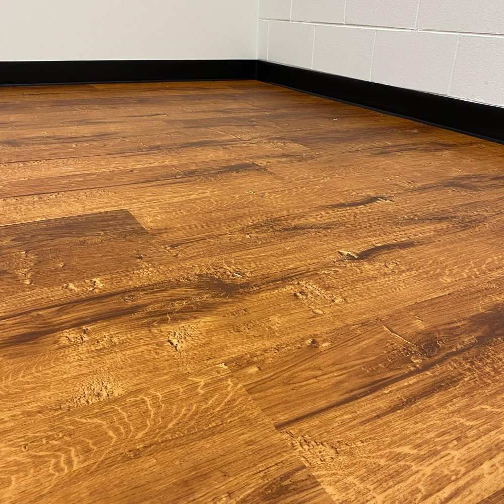 A Close Up of a Wooden Floor in a Room — John Chisholm Flooring in Manunda, QLD
