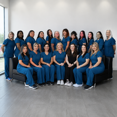 A group of women holding a sign that says dentistry 4 children