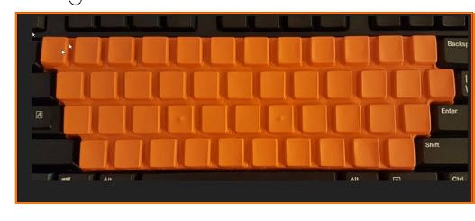 This is a SpeedSkn PC cover on a keyboard. Its fitted keys secure the cover on the keyboard to peek-proof the keys. This cover accelerated typing mastery by hiding the letter key.s