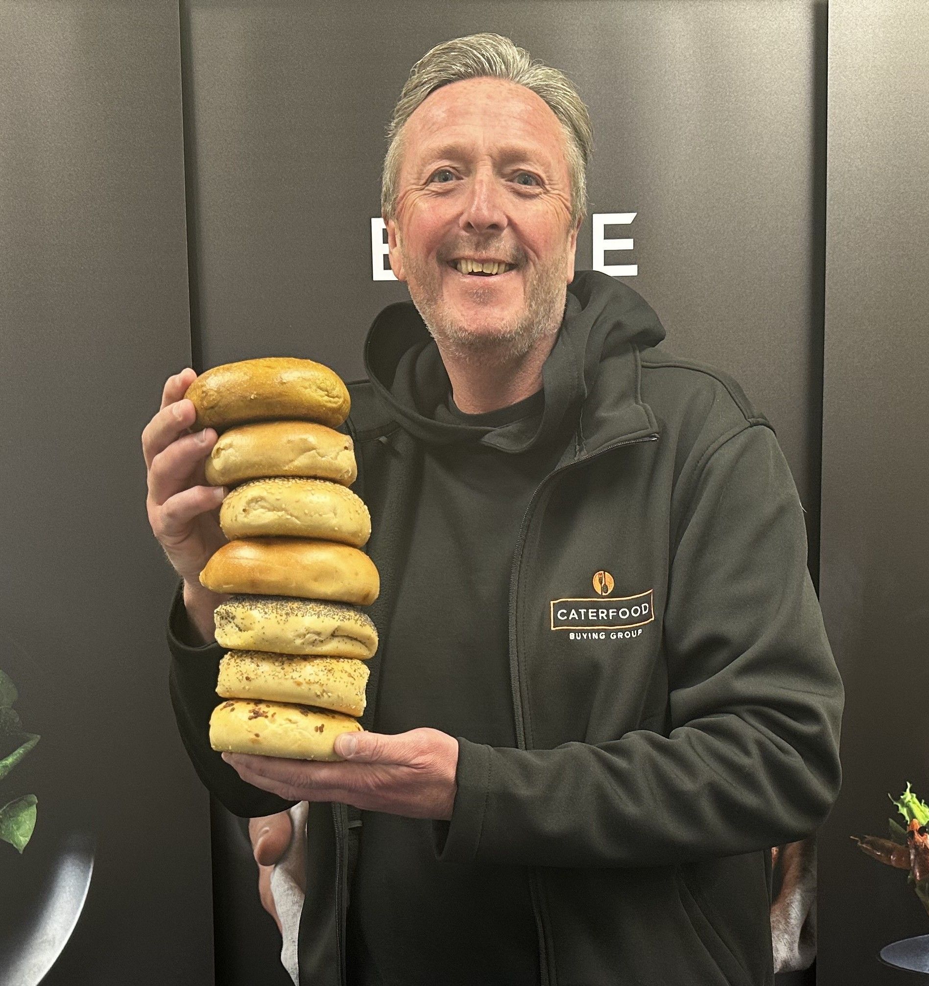 Gavin Scott from CFBG holding the new bagels to celebrate the launch at Elite Fine Foods