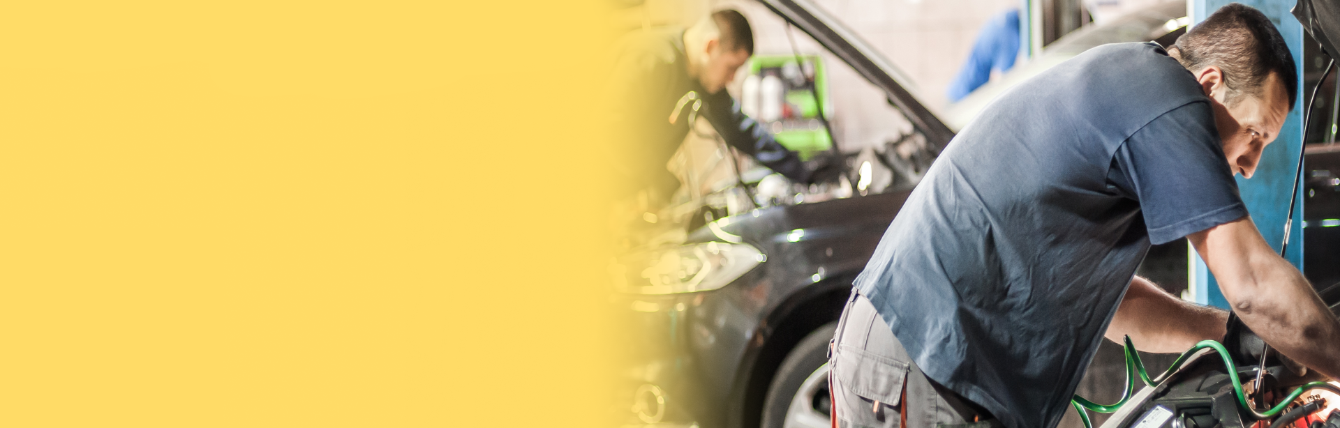 Technician working on vehicle with hood up | Automotive Repair Specialists