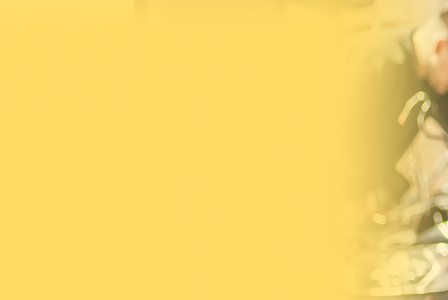 Yellow Background with Technician at work | Automotive Repair Specialists