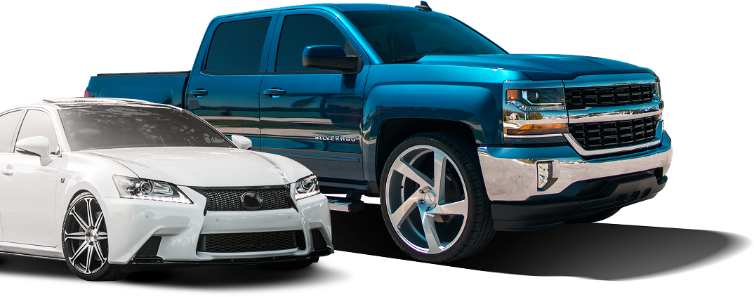 White car and blue truck parked | Automotive Repair Specialists