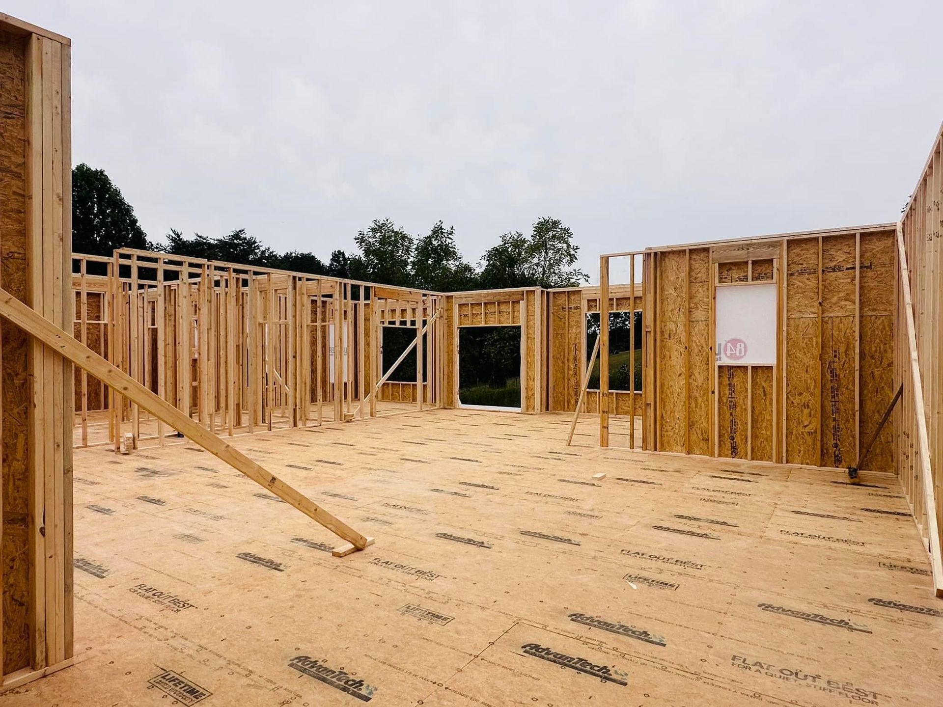 A house is being built with a lot of wooden frames