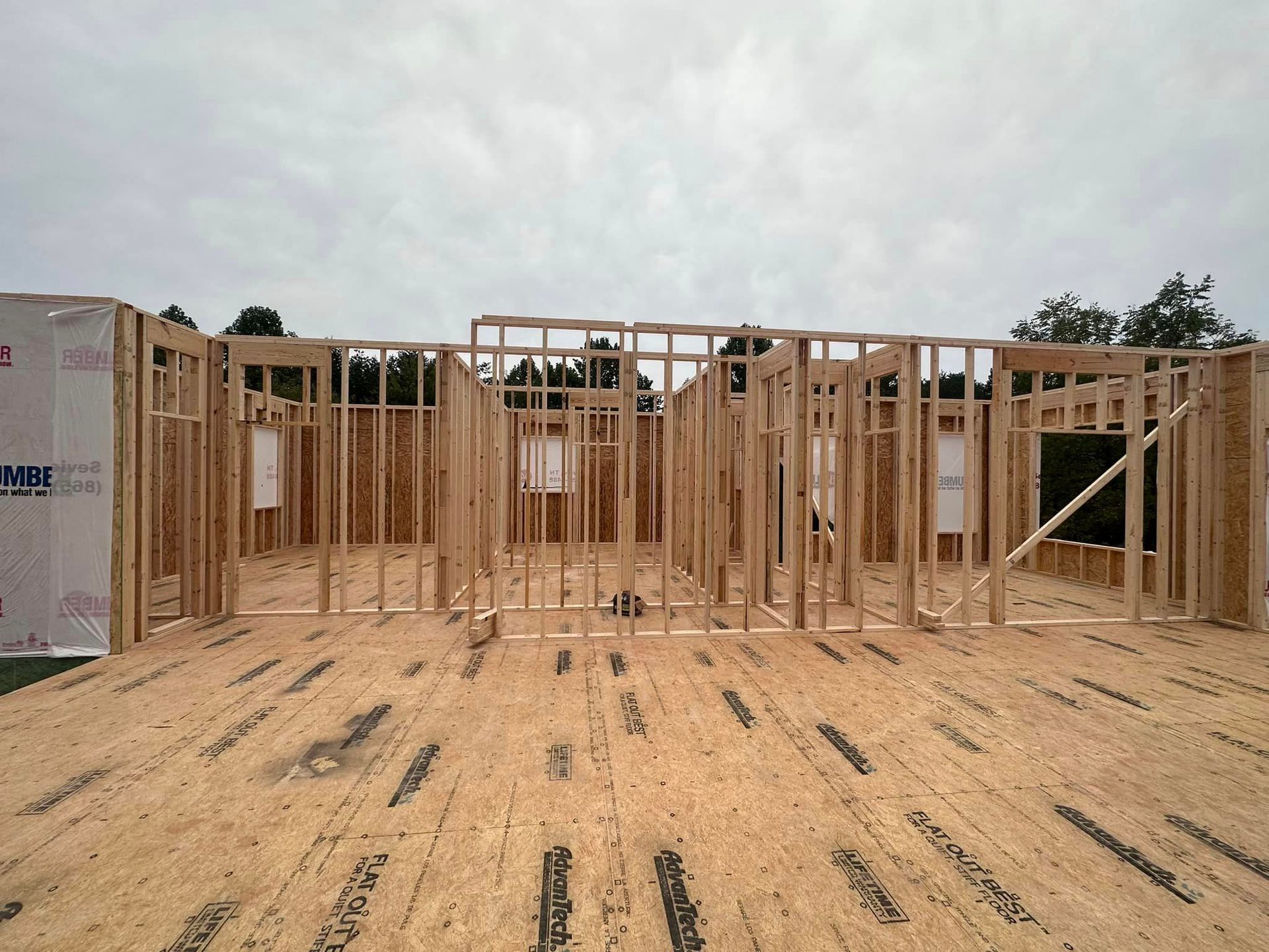 A house is being built with a lot of wooden frames.