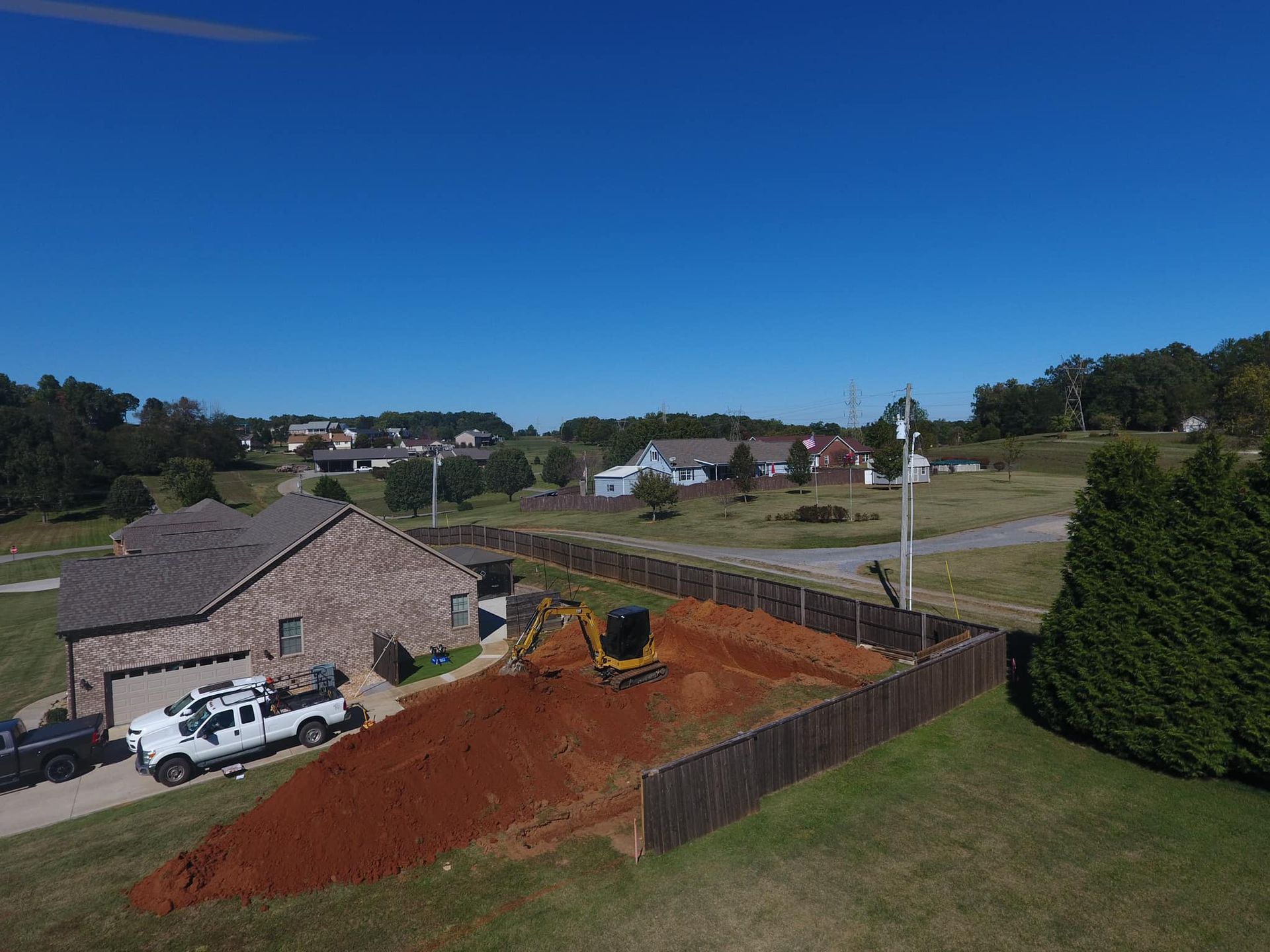An aerial view of a house with a truck parked in front of it.