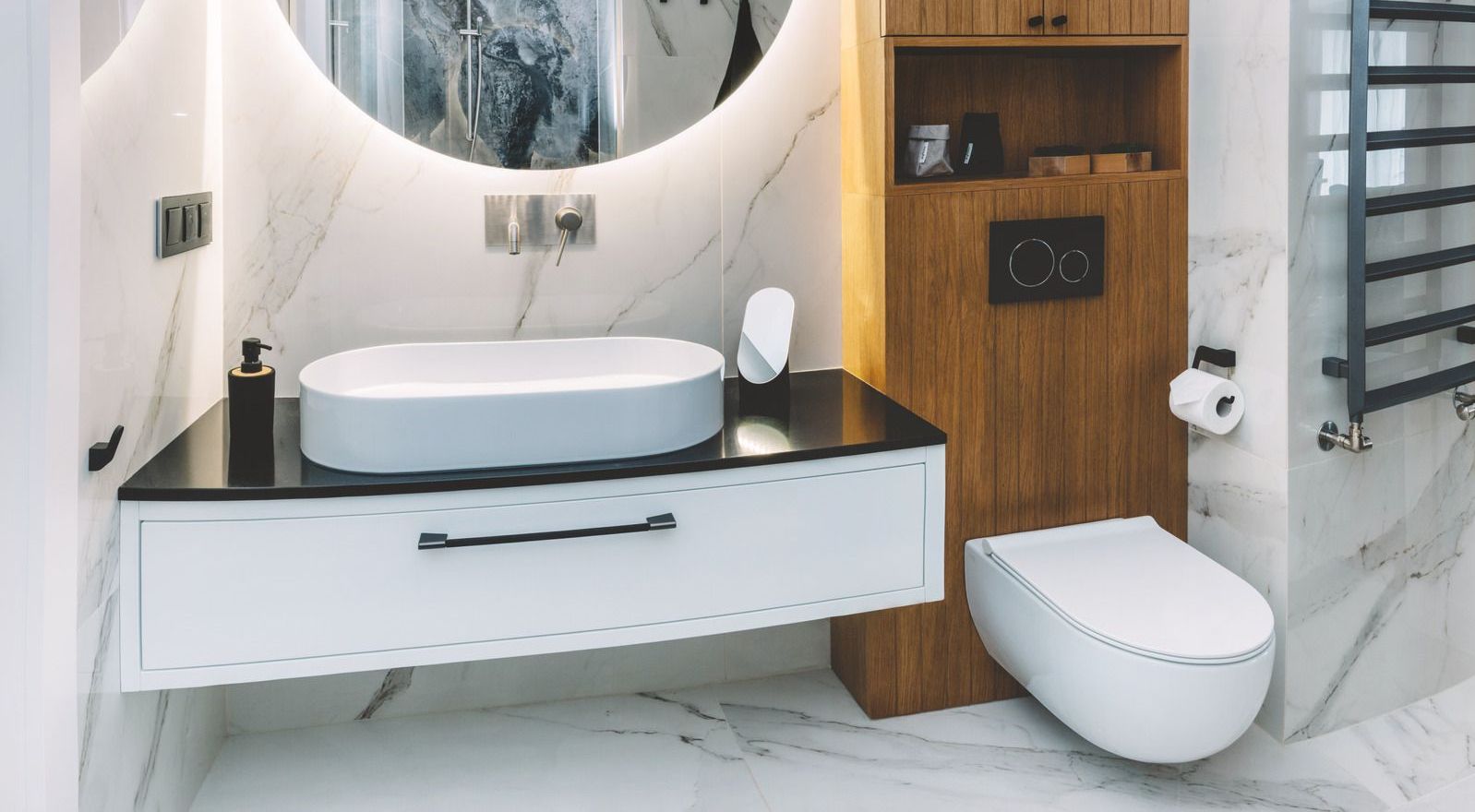 A bathroom with a sink , toilet and mirror.