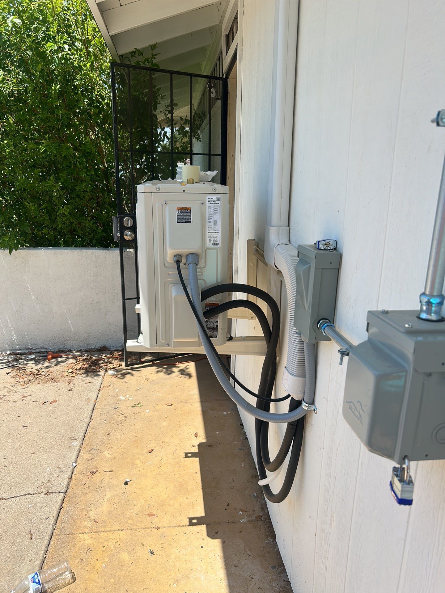 A hose is attached to the side of a building.