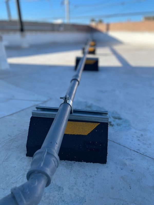 A close up of a pipe with a yellow arrow on it
