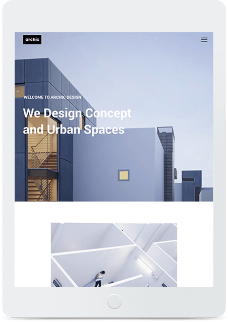 A tablet is open to a website that says we design concept and urban spaces.