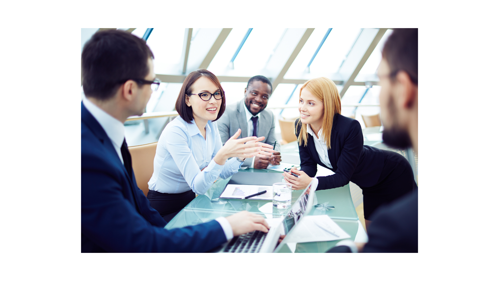 Image of people taking in a board room