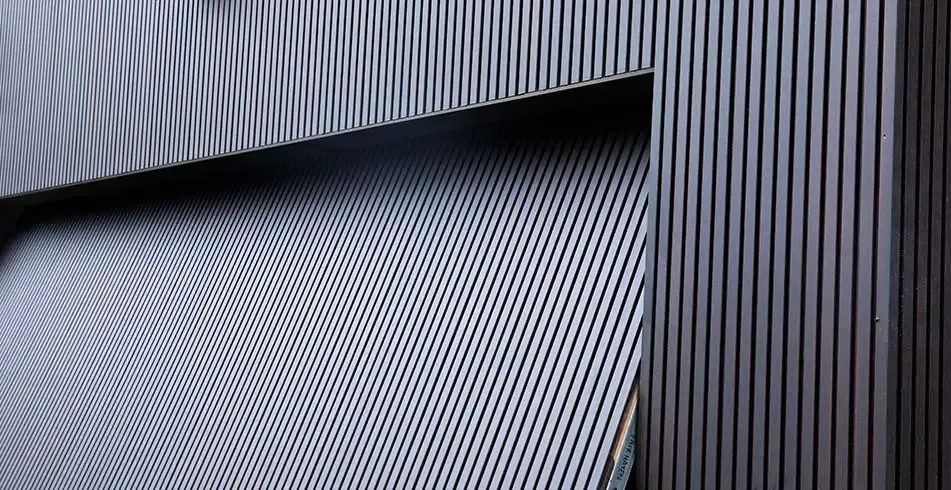 A Close Up of a Metal Wall With a Striped Pattern — Hastings Garage Door Services in Port Macquarie